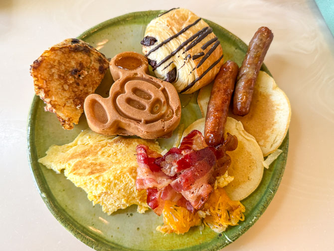Buffet plate with Mickey waffles and breakfast items at Crystal Palace, Magic Kingdom