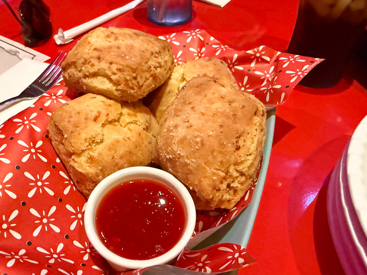 Prospector's homemade cheddar biscuits with sweet pepper jelly at Roundup Rodeo BBQ