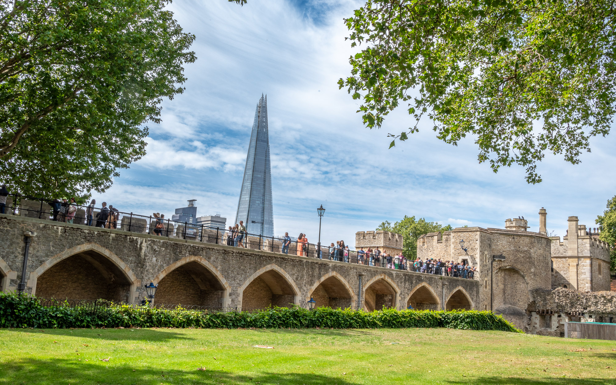 Walls of the Tower of London with The Shard in the background
